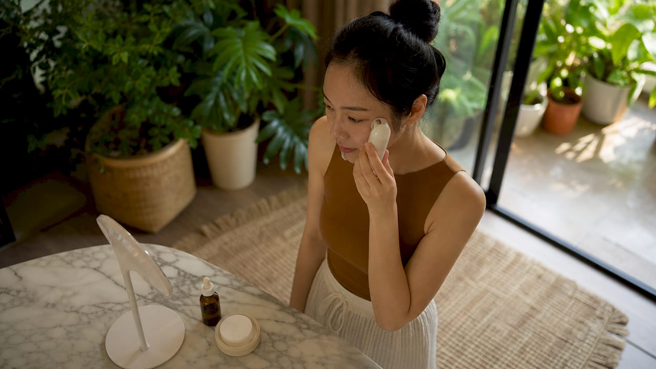 What is a haptic feedback beauty device?